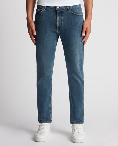Man wearing a blue Roman Modern Straight Fit Cotton-Stretch Jean