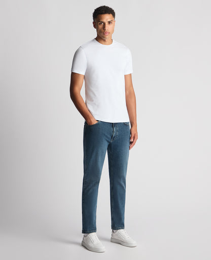 Man wearing a blue Roman Modern Straight Fit Cotton-Stretch Jean