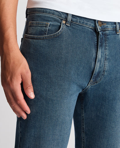 Man wearing a blue Roman Modern Straight Fit Cotton-Stretch Jean