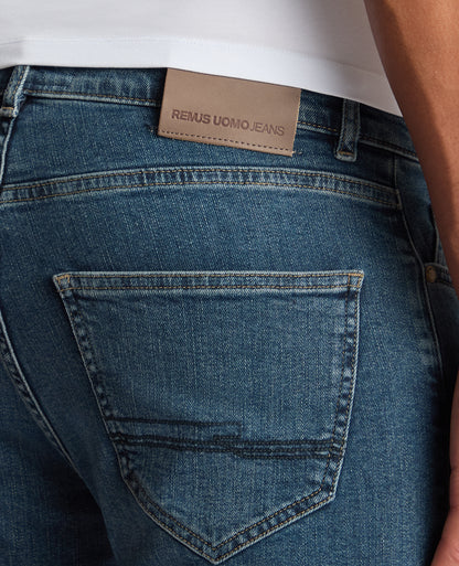 Man wearing a blue Roman Modern Straight Fit Cotton-Stretch Jean