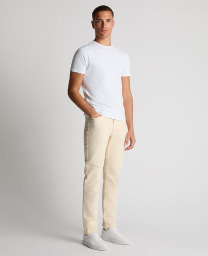 Man wearing a sand Roman Modern Straight Fit Cotton-Stretch Jean