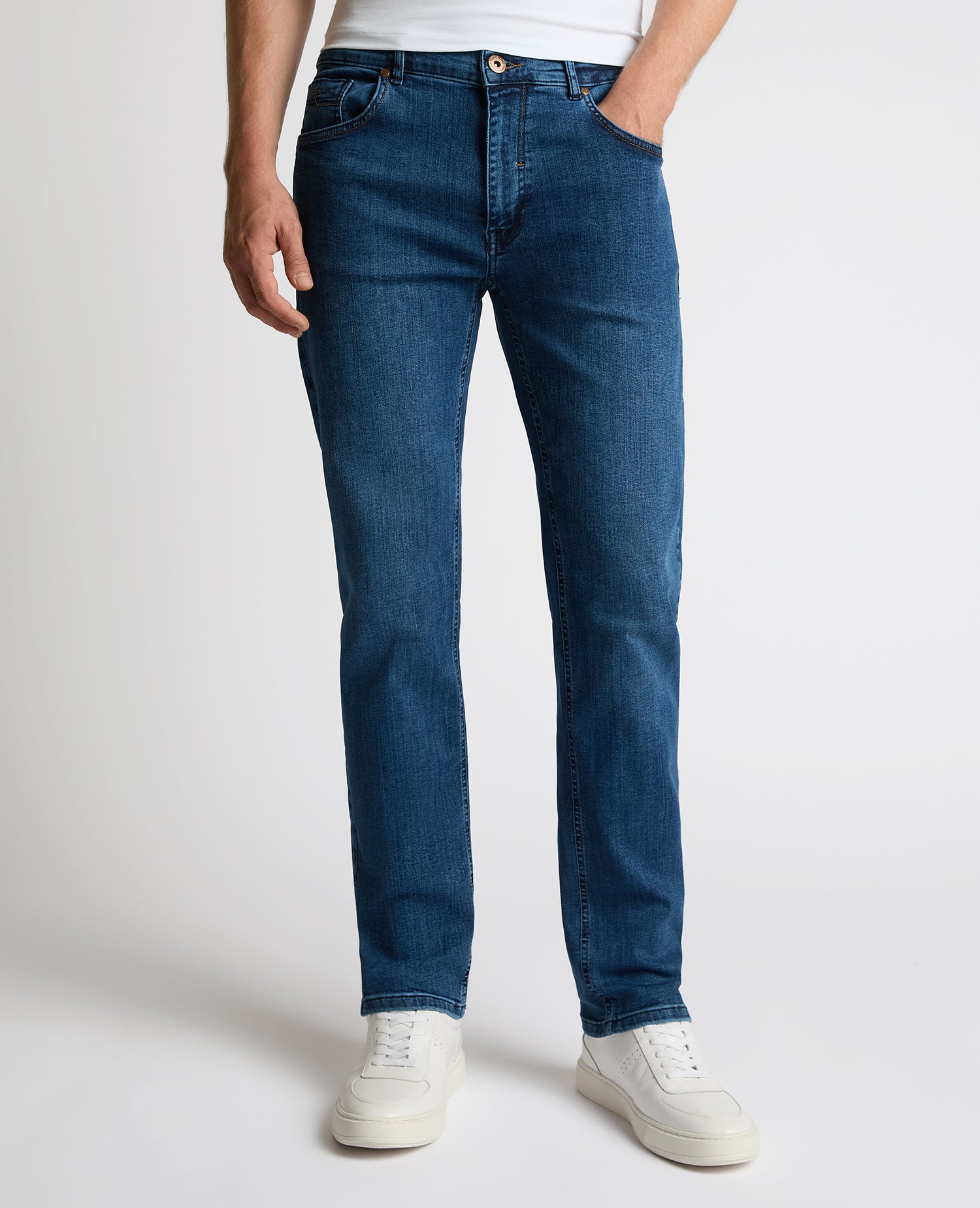 Man wearing a blue Rogan Straight Leg Jeans