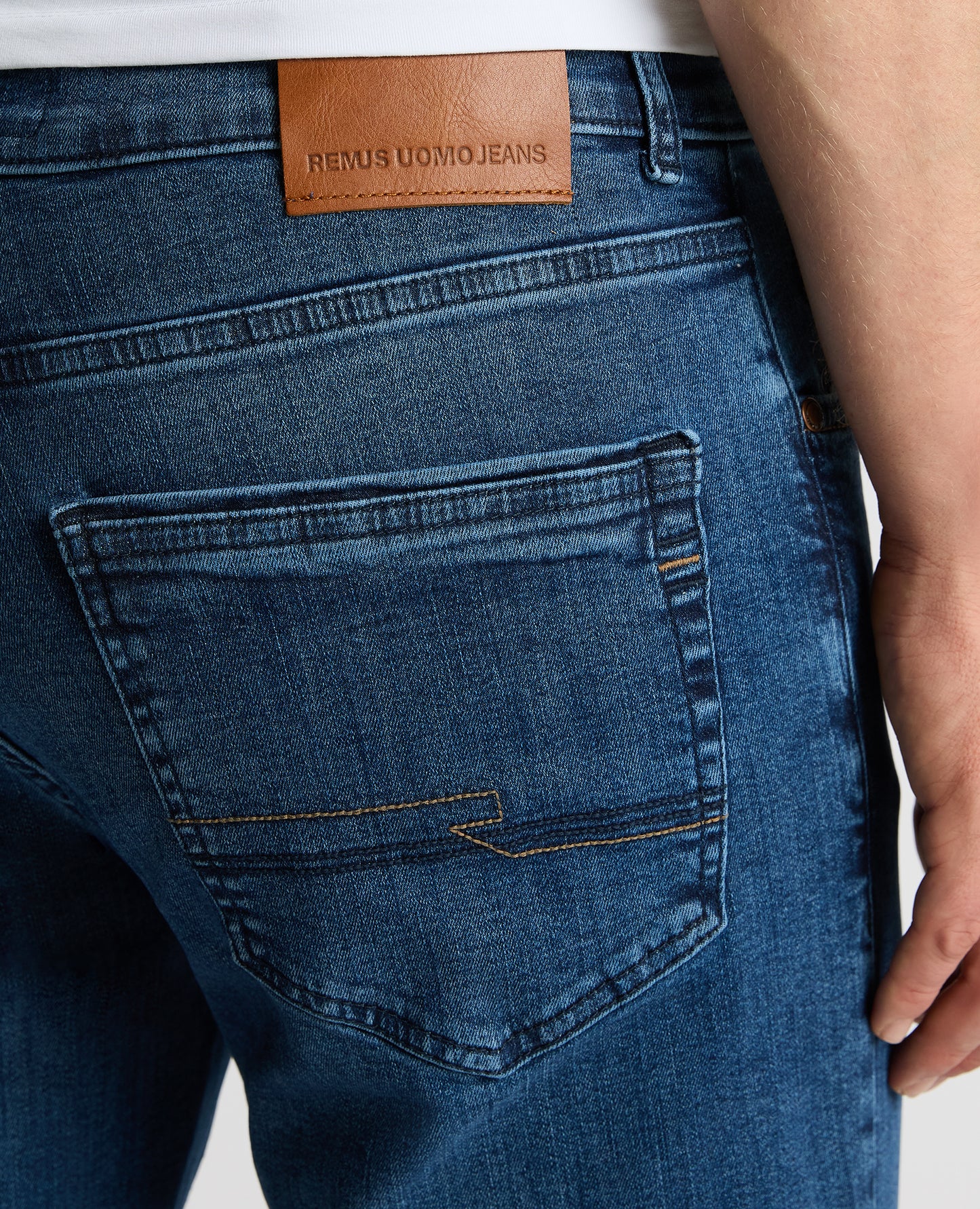 Man wearing a blue Rogan Straight Leg Jeans