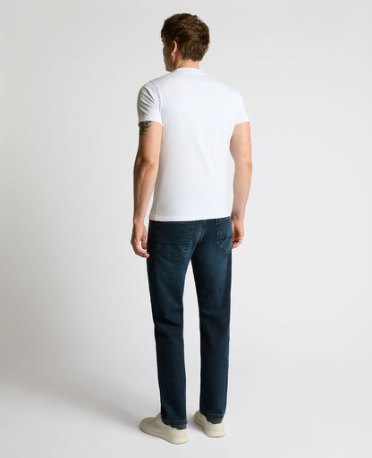 Man wearing a navy Rogan Straight Leg Jeans
