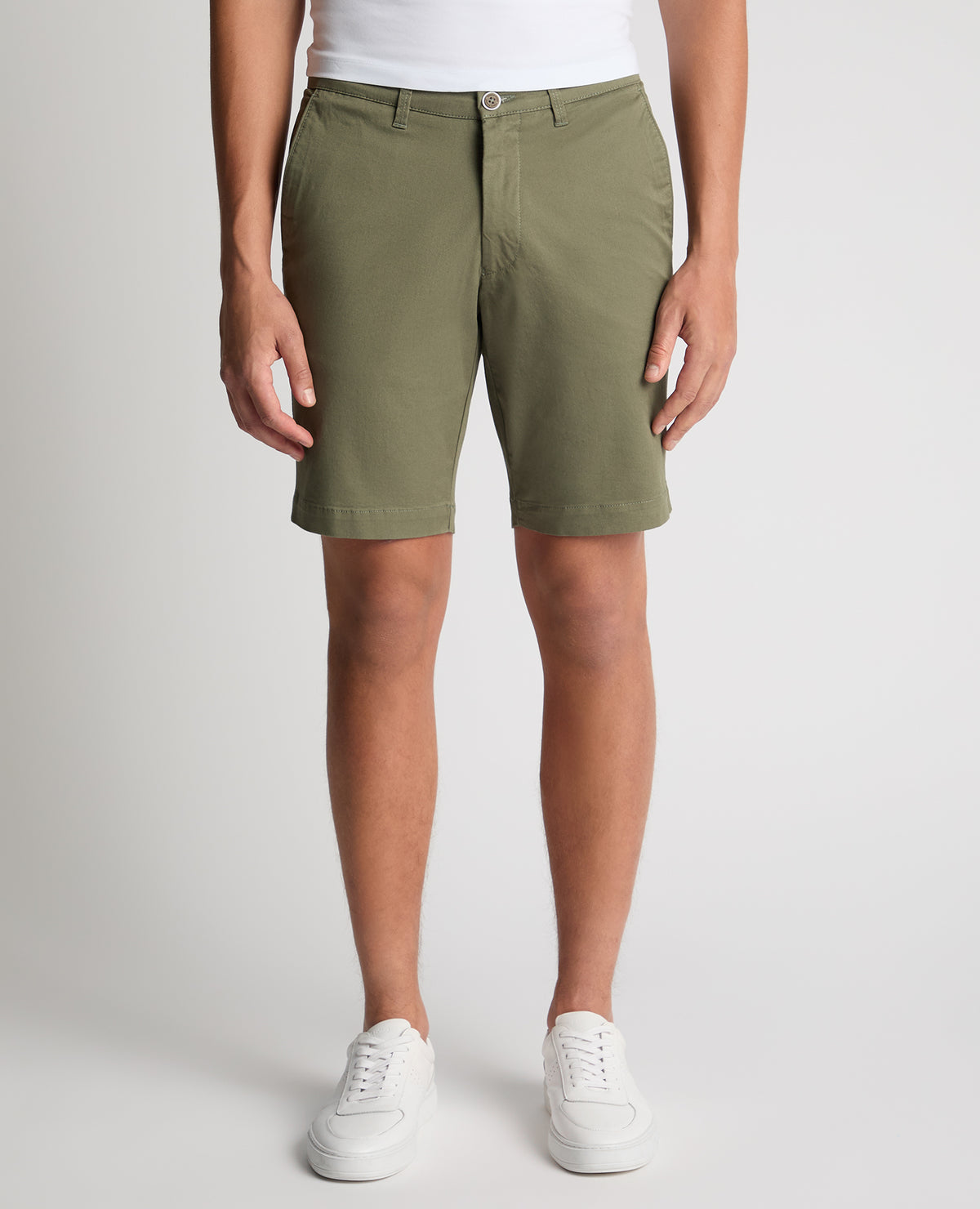 Man wearing a green Slim Leg Cotton-Stretch Chino Short