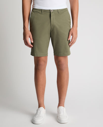 Man wearing a green Slim Leg Cotton-Stretch Chino Short