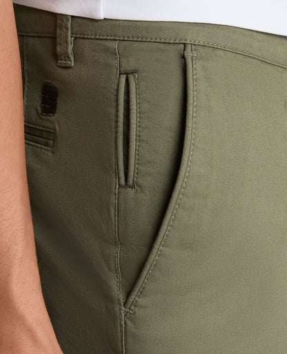 Man wearing a green Slim Leg Cotton-Stretch Chino Short