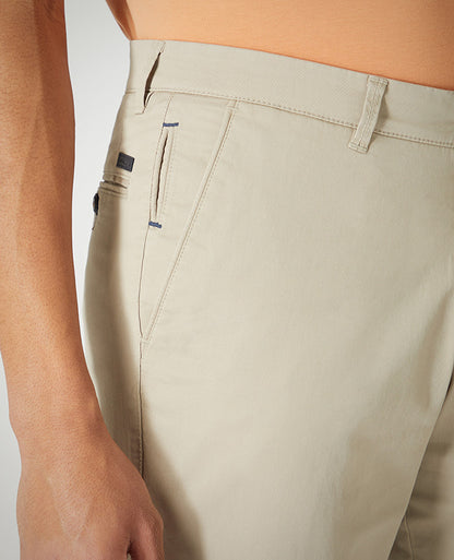 Man wearing a sand Slim Leg Cotton-Stretch Chino Short
