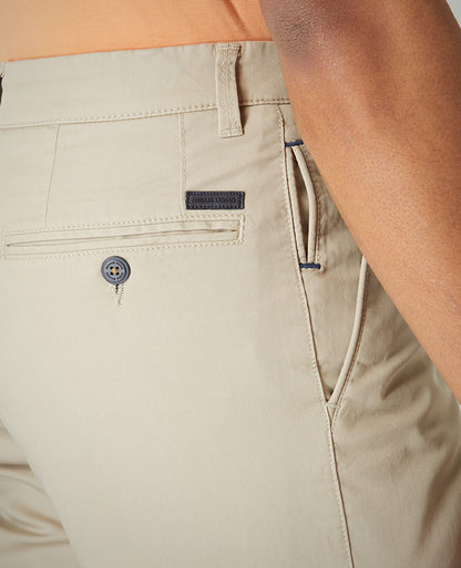 Man wearing a sand Slim Leg Cotton-Stretch Chino Short
