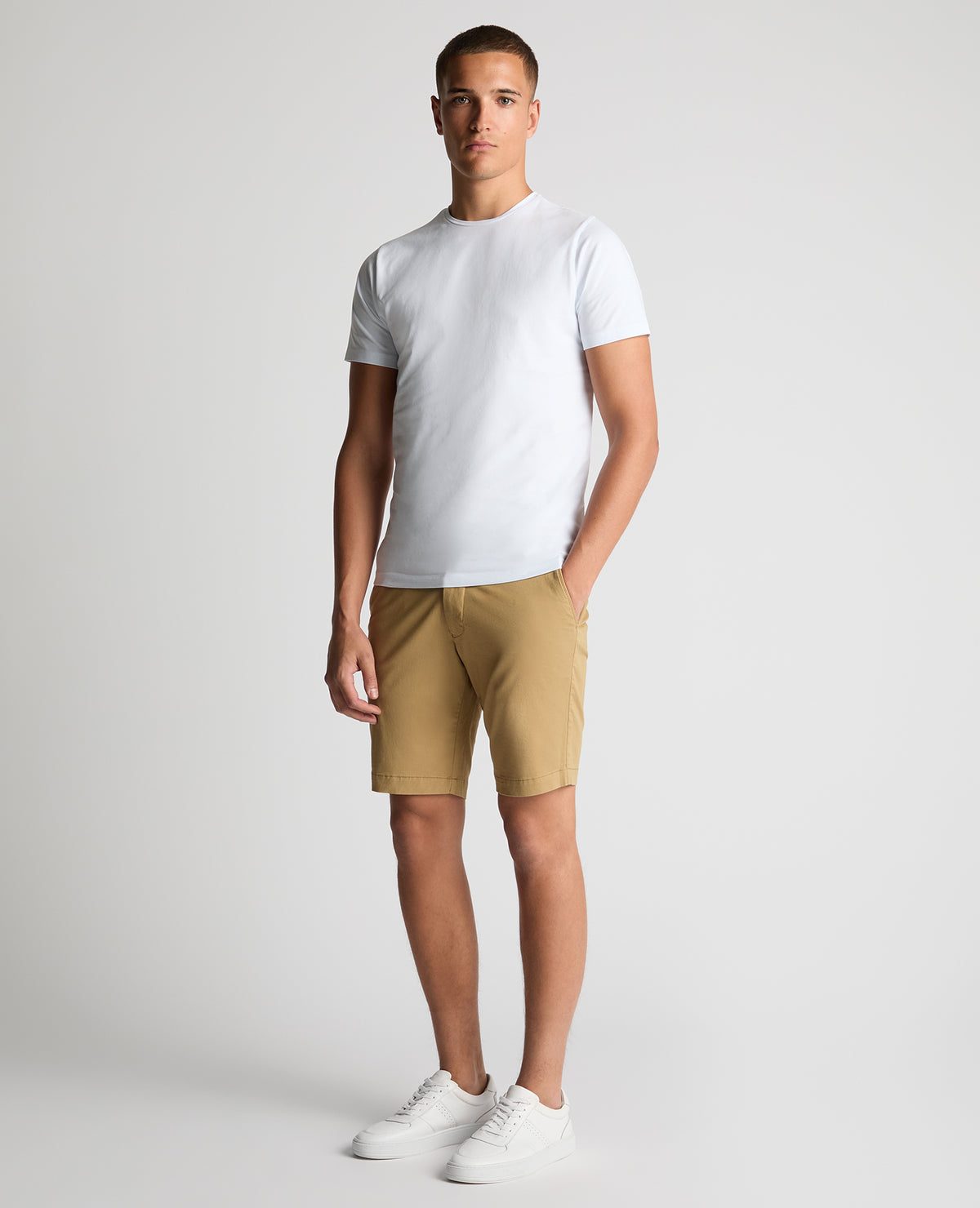 Man wearing a sand Slim Leg Cotton-Stretch Chino Short