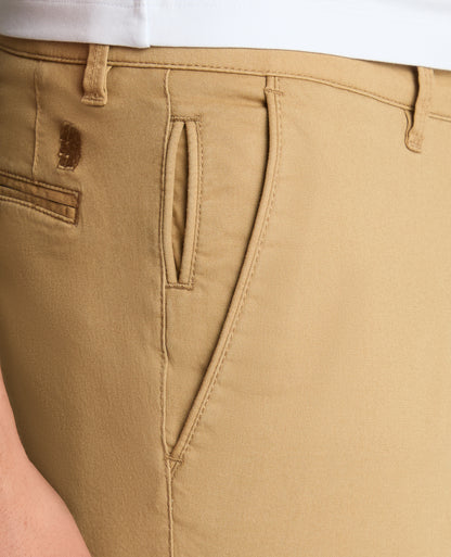 Man wearing a sand Slim Leg Cotton-Stretch Chino Short