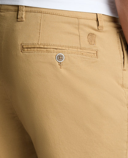 Man wearing a sand Slim Leg Cotton-Stretch Chino Short