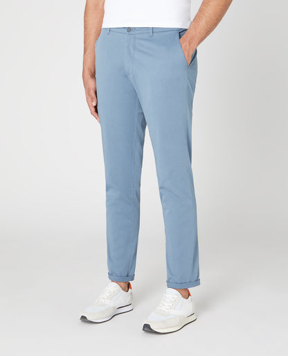 Man wearing a blue Slim Leg Cotton Stretch Chinos
