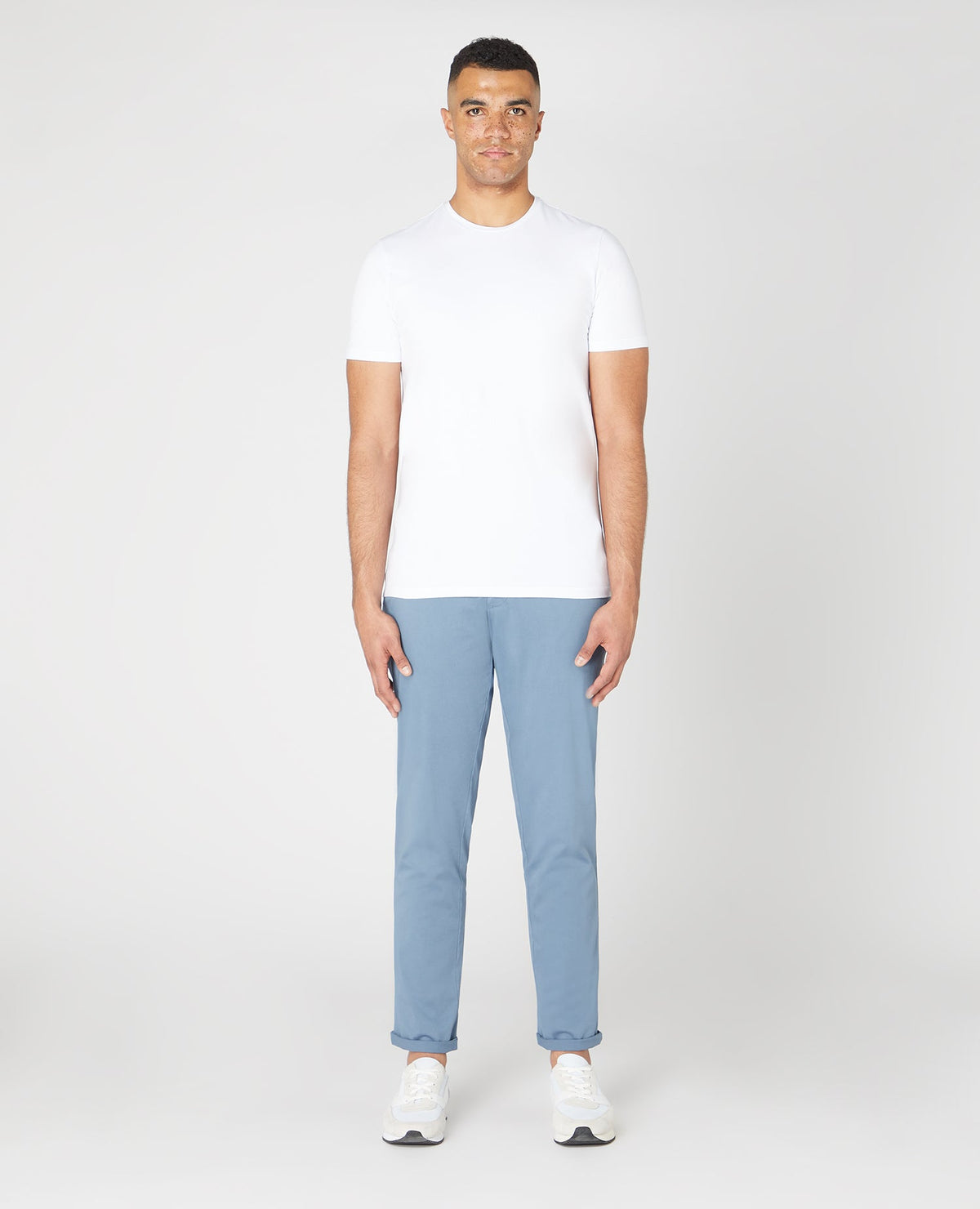 Man wearing a blue Slim Leg Cotton Stretch Chinos