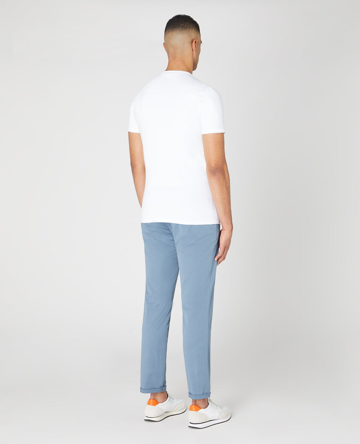 Man wearing a blue Slim Leg Cotton Stretch Chinos