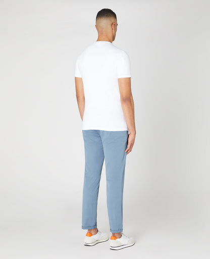 Man wearing a blue Slim Leg Cotton Stretch Chinos