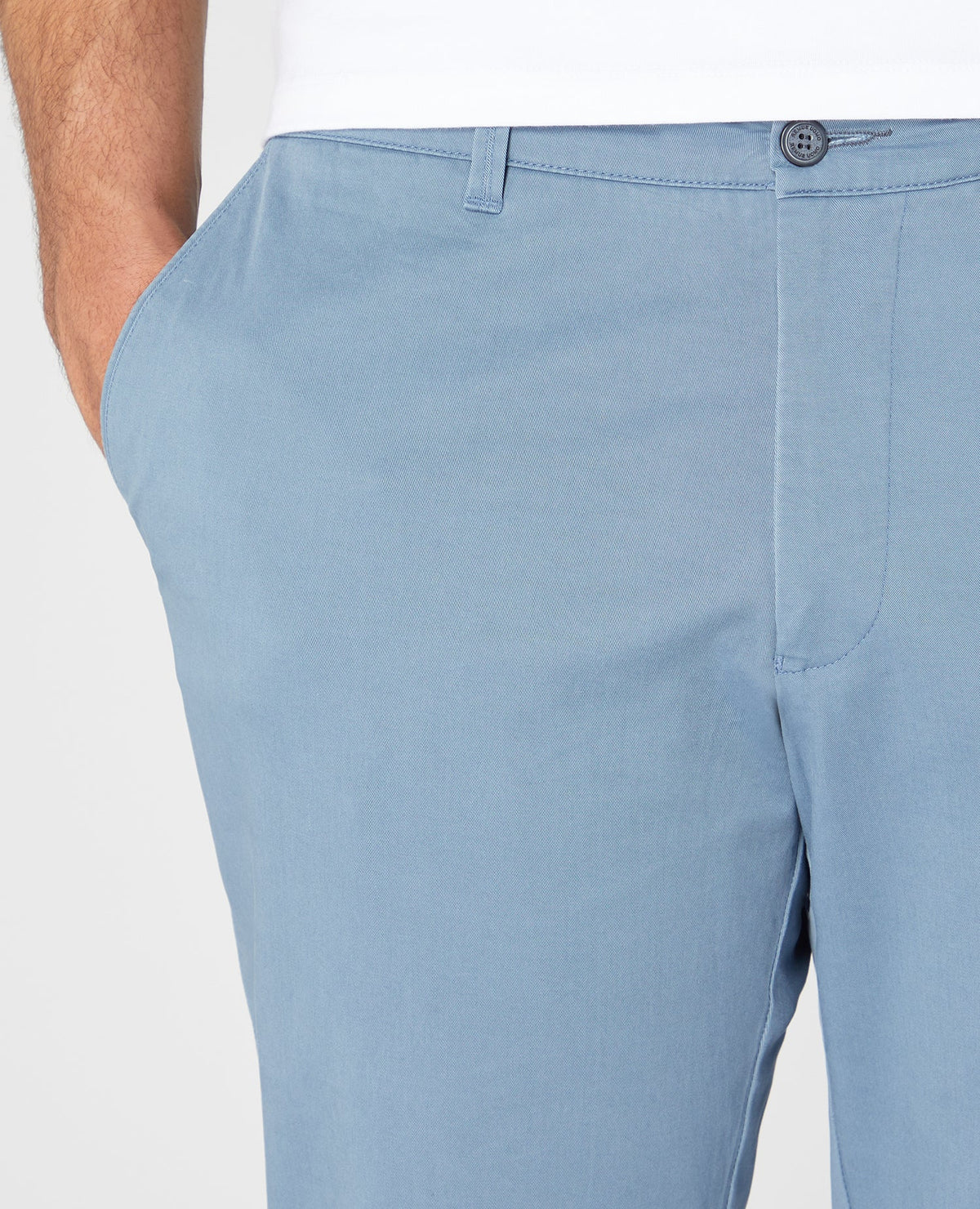 Man wearing a blue Slim Leg Cotton Stretch Chinos