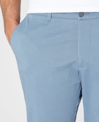 Man wearing a blue Slim Leg Cotton Stretch Chinos