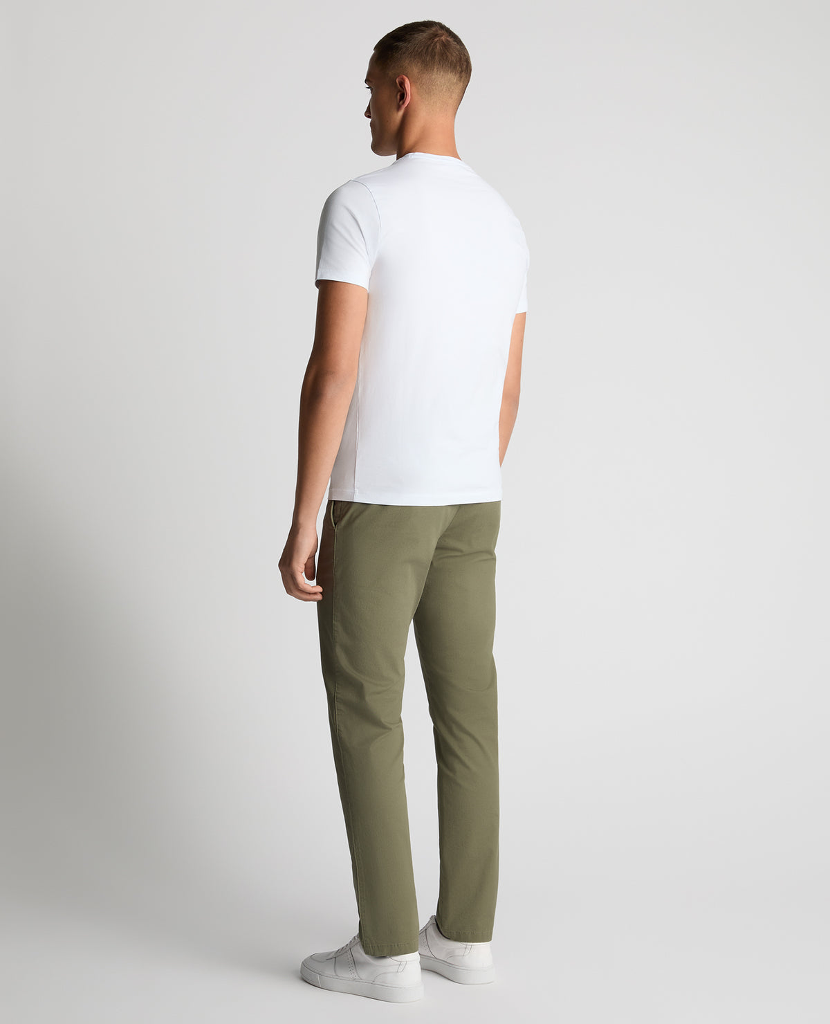 Man wearing a green Slim Leg Cotton-Stretch Chinos