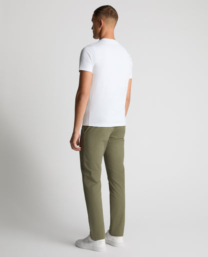 Man wearing a green Slim Leg Cotton-Stretch Chinos