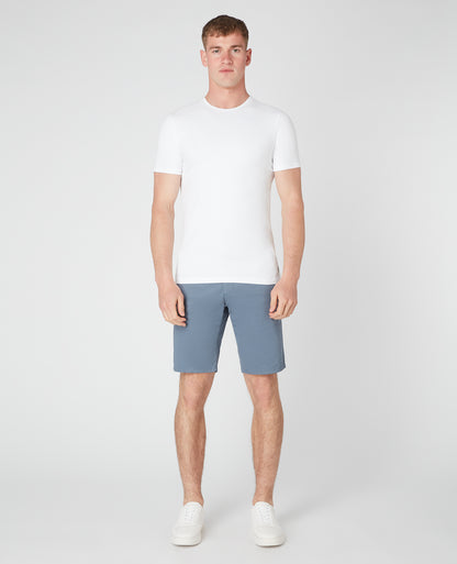 Man wearing a blue Slim Leg Cotton-Stretch Chino Short