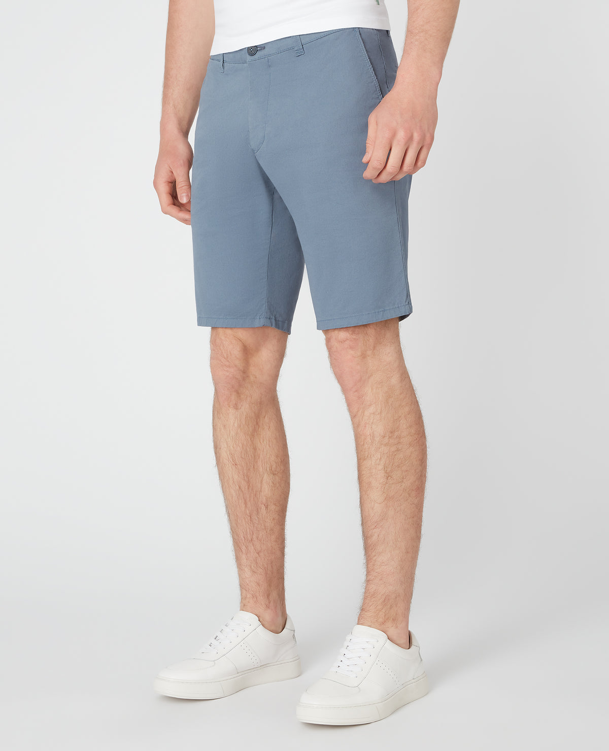 Man wearing a blue Slim Leg Cotton-Stretch Chino Short