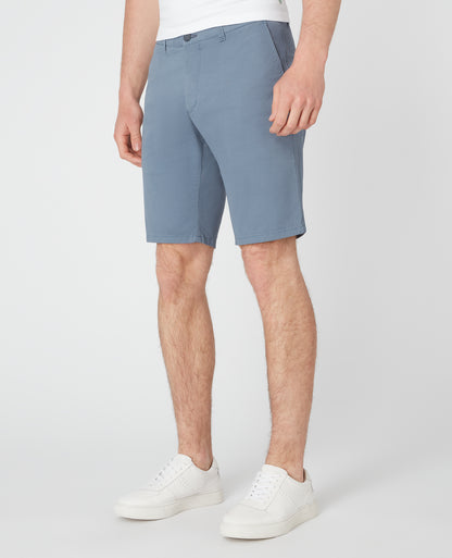 Man wearing a blue Slim Leg Cotton-Stretch Chino Short