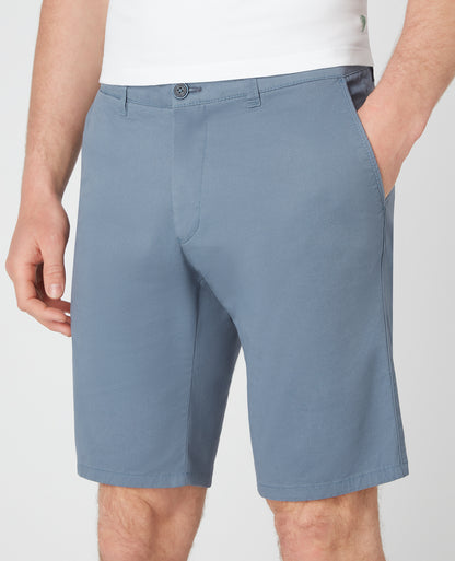 Man wearing a blue Slim Leg Cotton-Stretch Chino Short