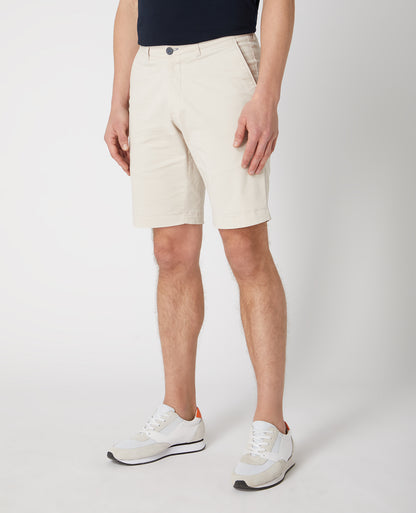 Man wearing a sand Slim Leg Cotton-Stretch Chino Short