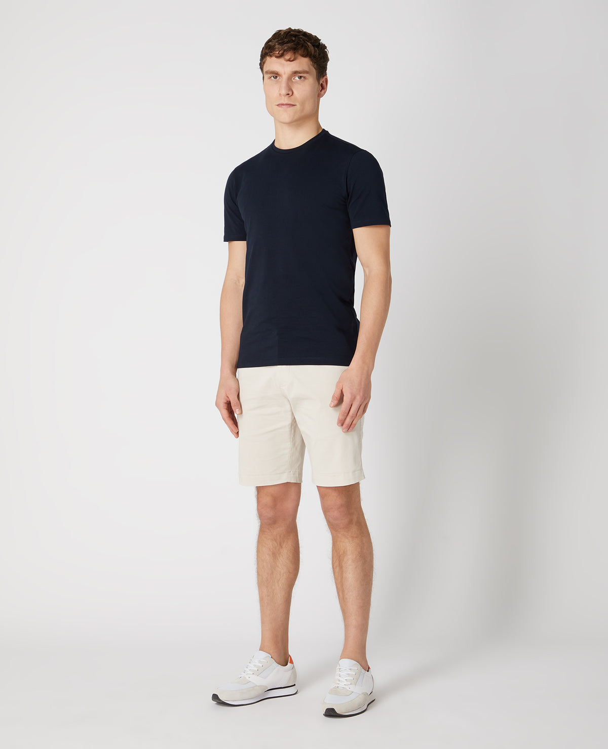 Man wearing a sand Slim Leg Cotton-Stretch Chino Short