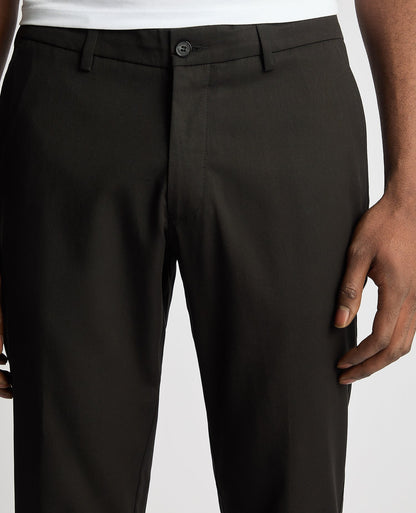 Man wearing a black Slim Leg Stretch Smart Chinos