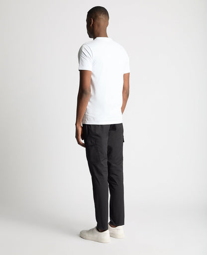 Man wearing a navy Slim Leg Cotton Stretch Cargo