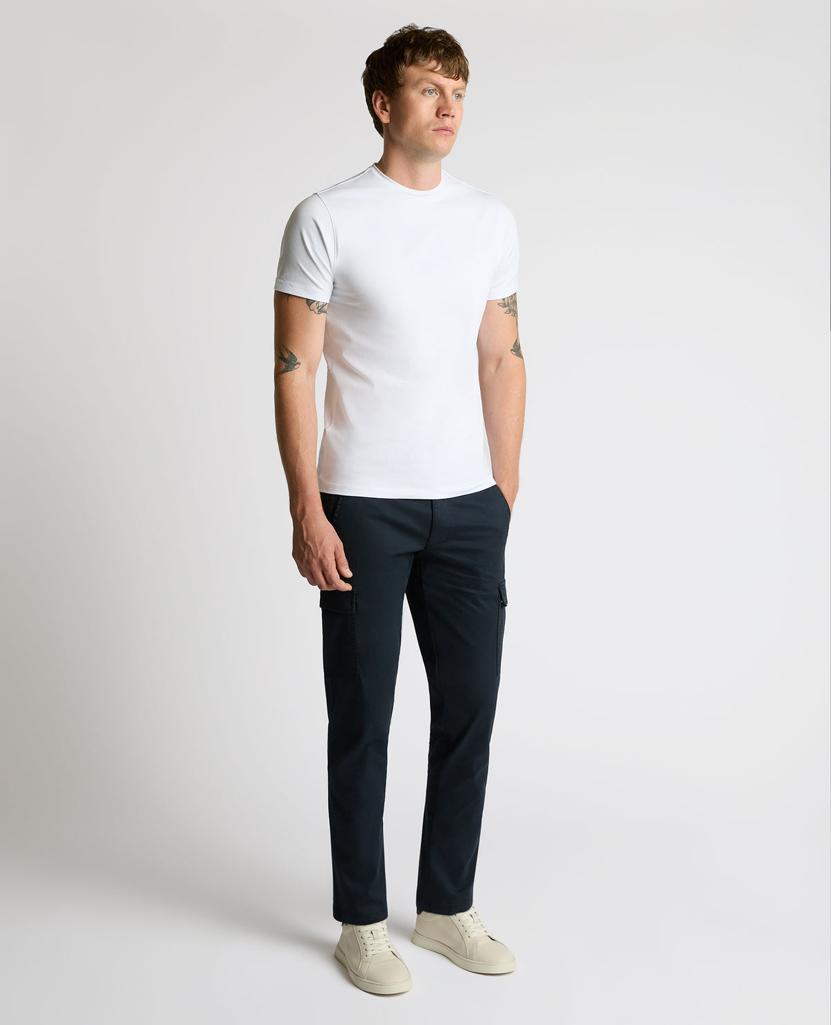 Man wearing a blue Slim Leg Cotton-Stretch Eton Cargos