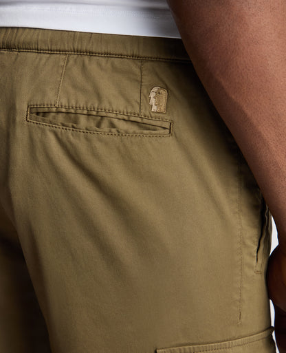 Man wearing a green Slim Fit Cotton Stretch Cargos