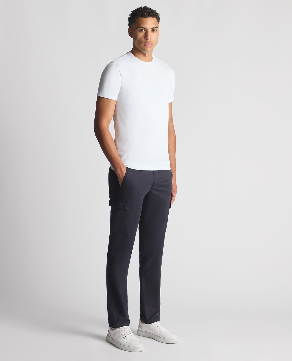 Man wearing a navy Slim Fit Cotton Stretch Cargos