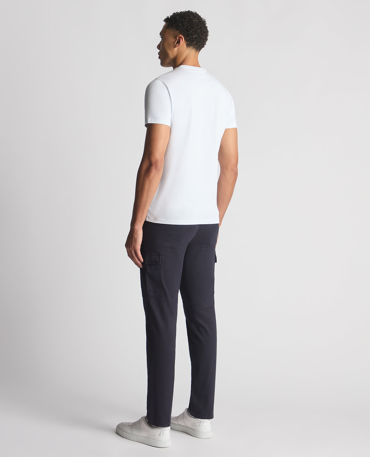 Man wearing a navy Slim Fit Cotton Stretch Cargos