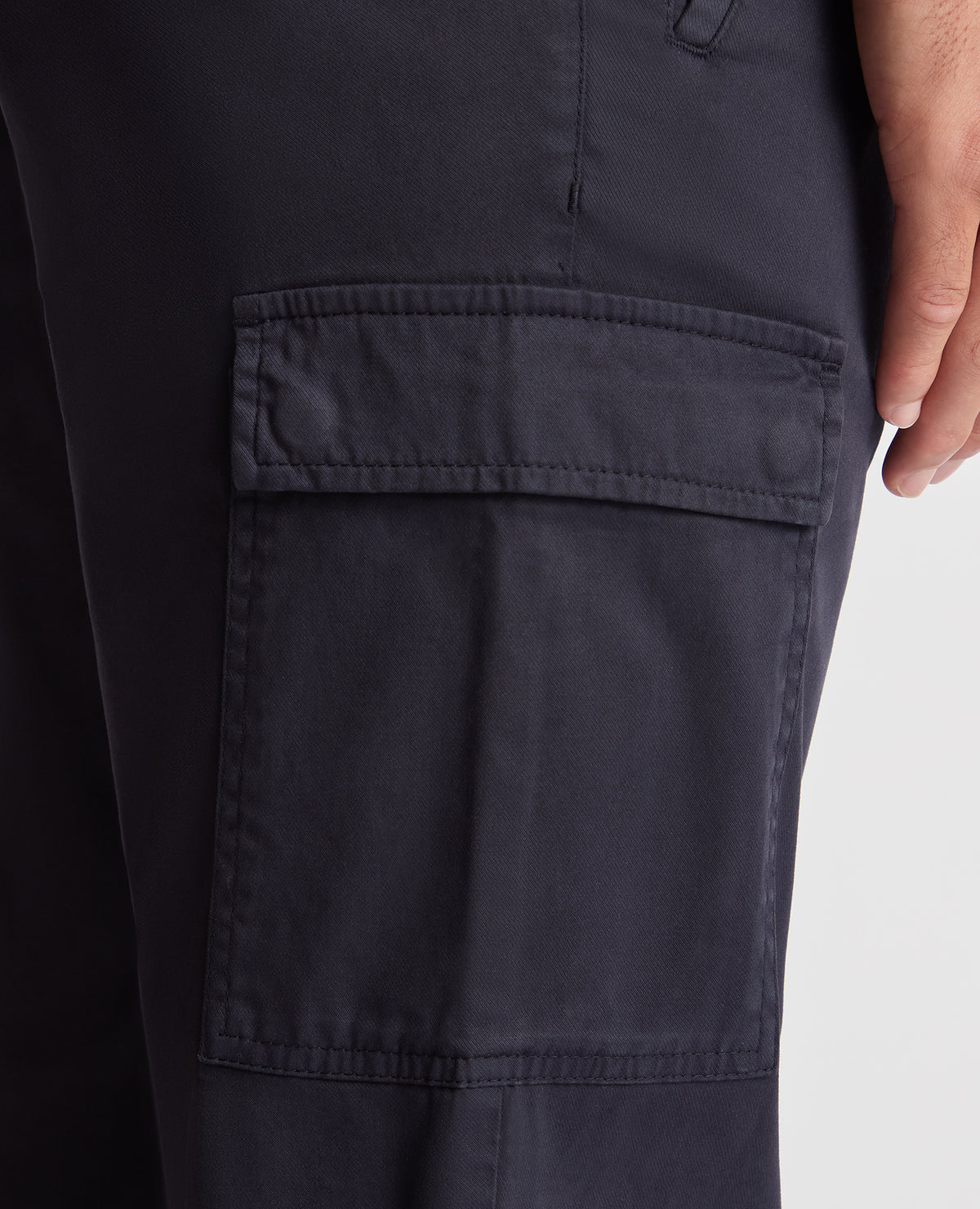 Man wearing a navy Slim Fit Cotton Stretch Cargos