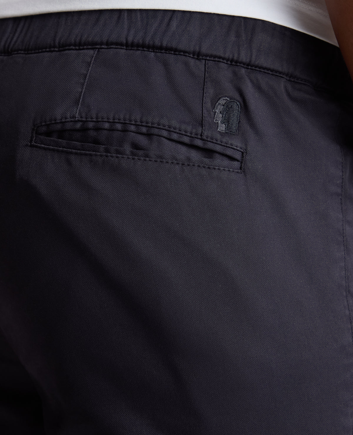 Man wearing a navy Slim Fit Cotton Stretch Cargos