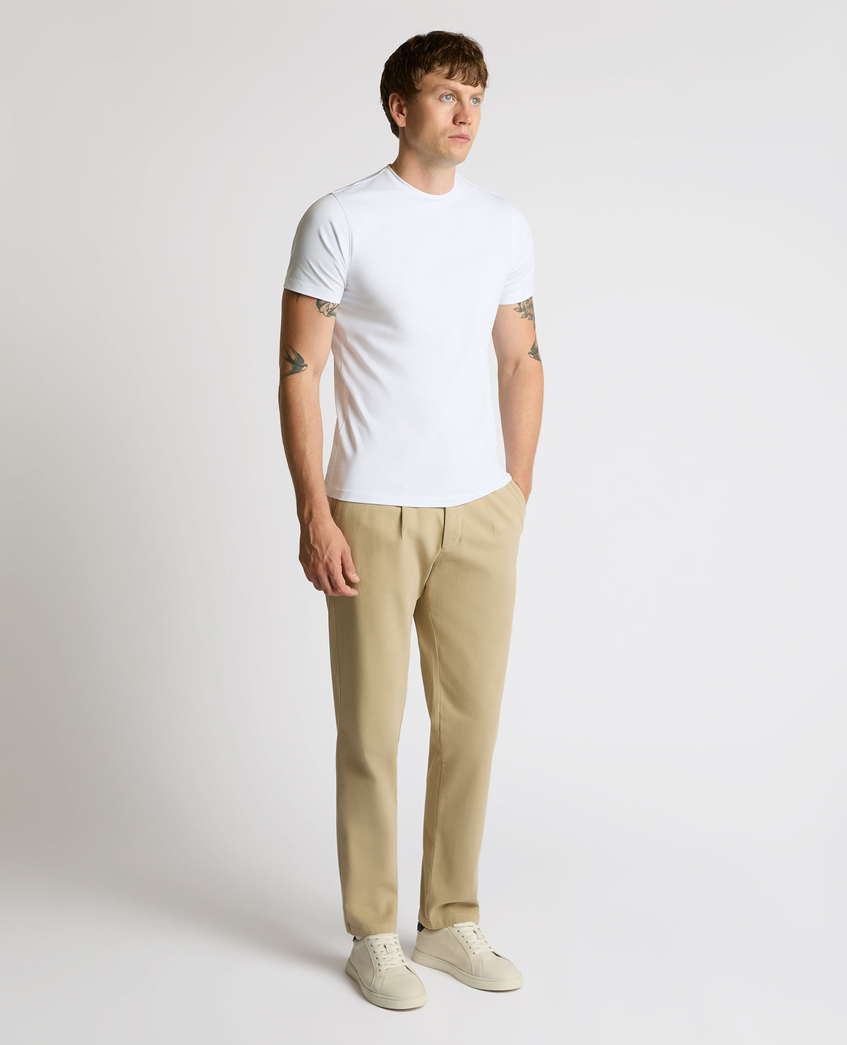 Man wearing a sand Straight Leg Cotton-Stretch Riley Chinos