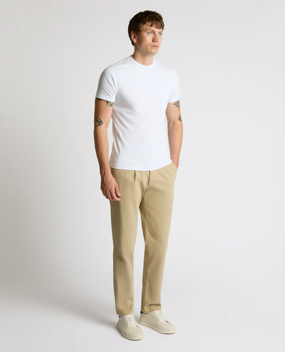 Man wearing a sand Straight Leg Cotton-Stretch Riley Chinos