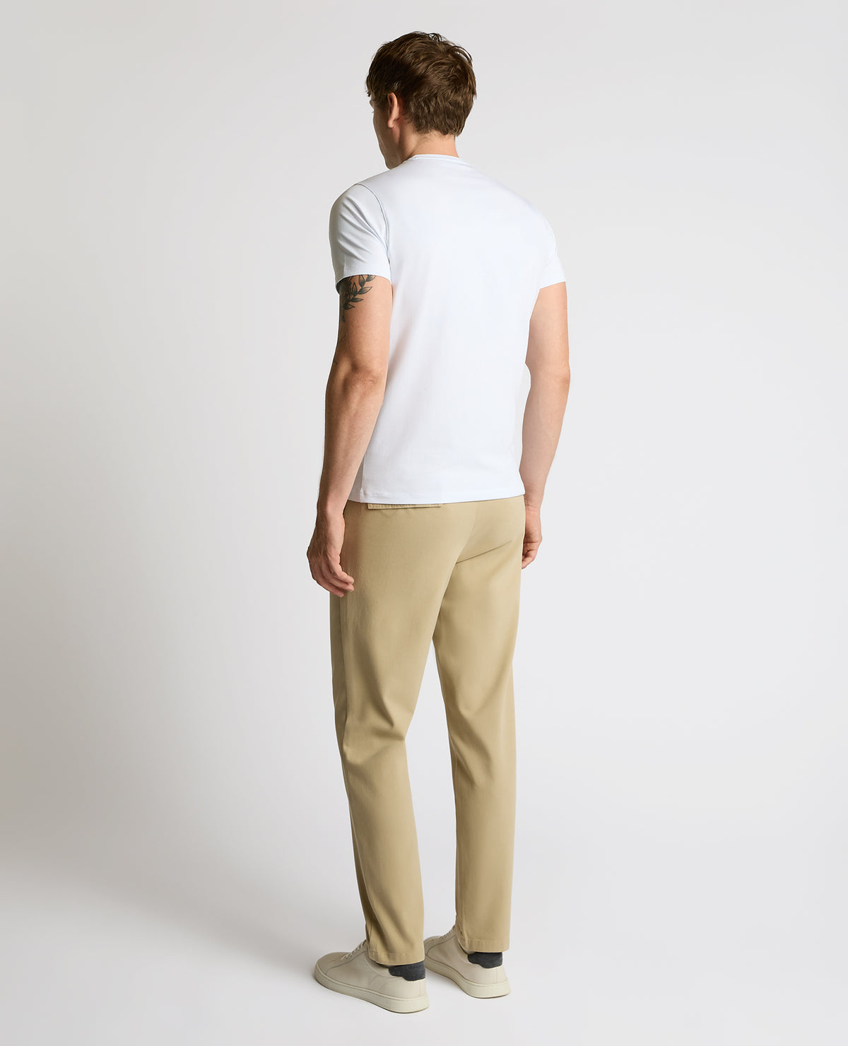 Man wearing a sand Straight Leg Cotton-Stretch Riley Chinos