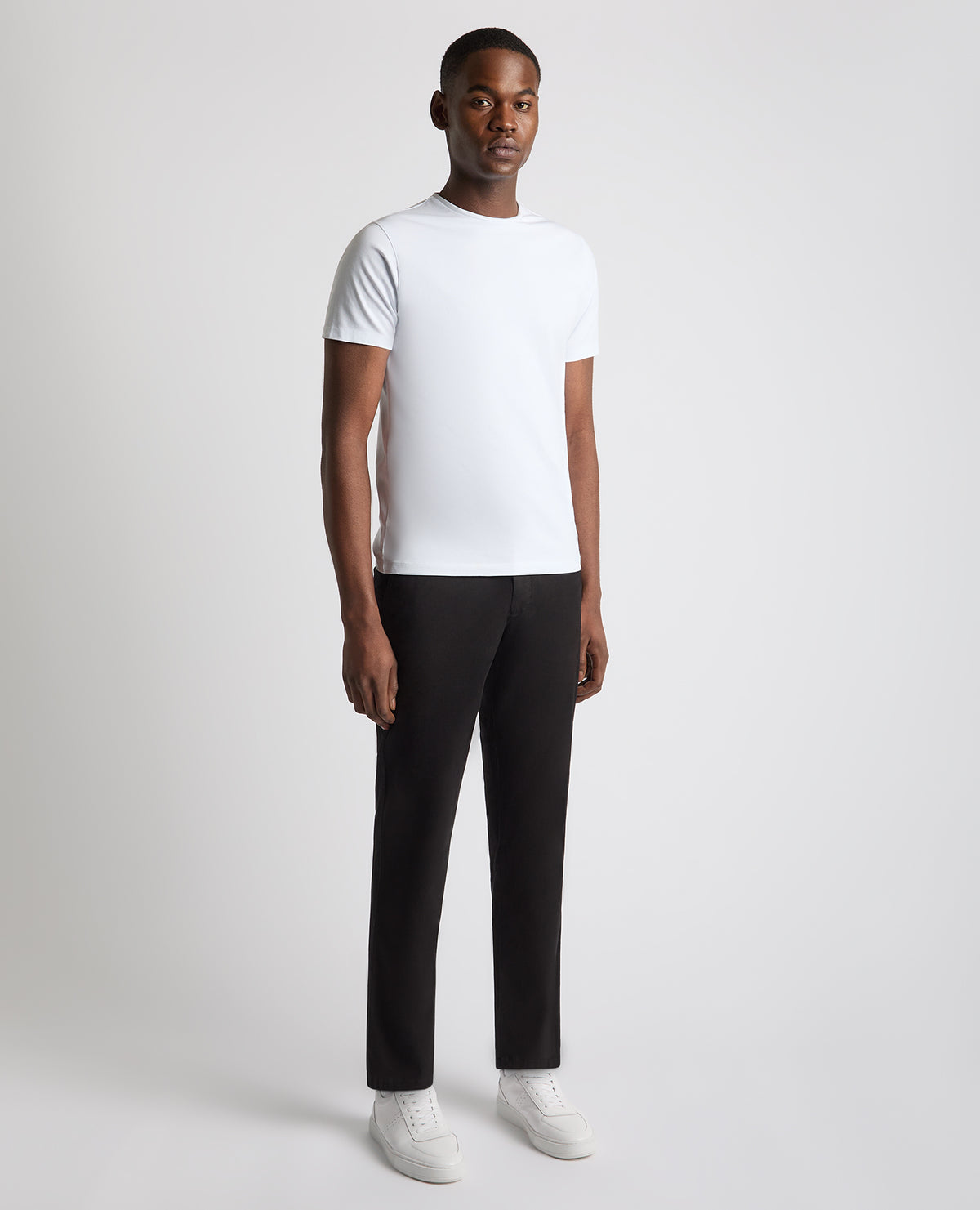 Man wearing a black Straight Leg Cotton Stretch Chino