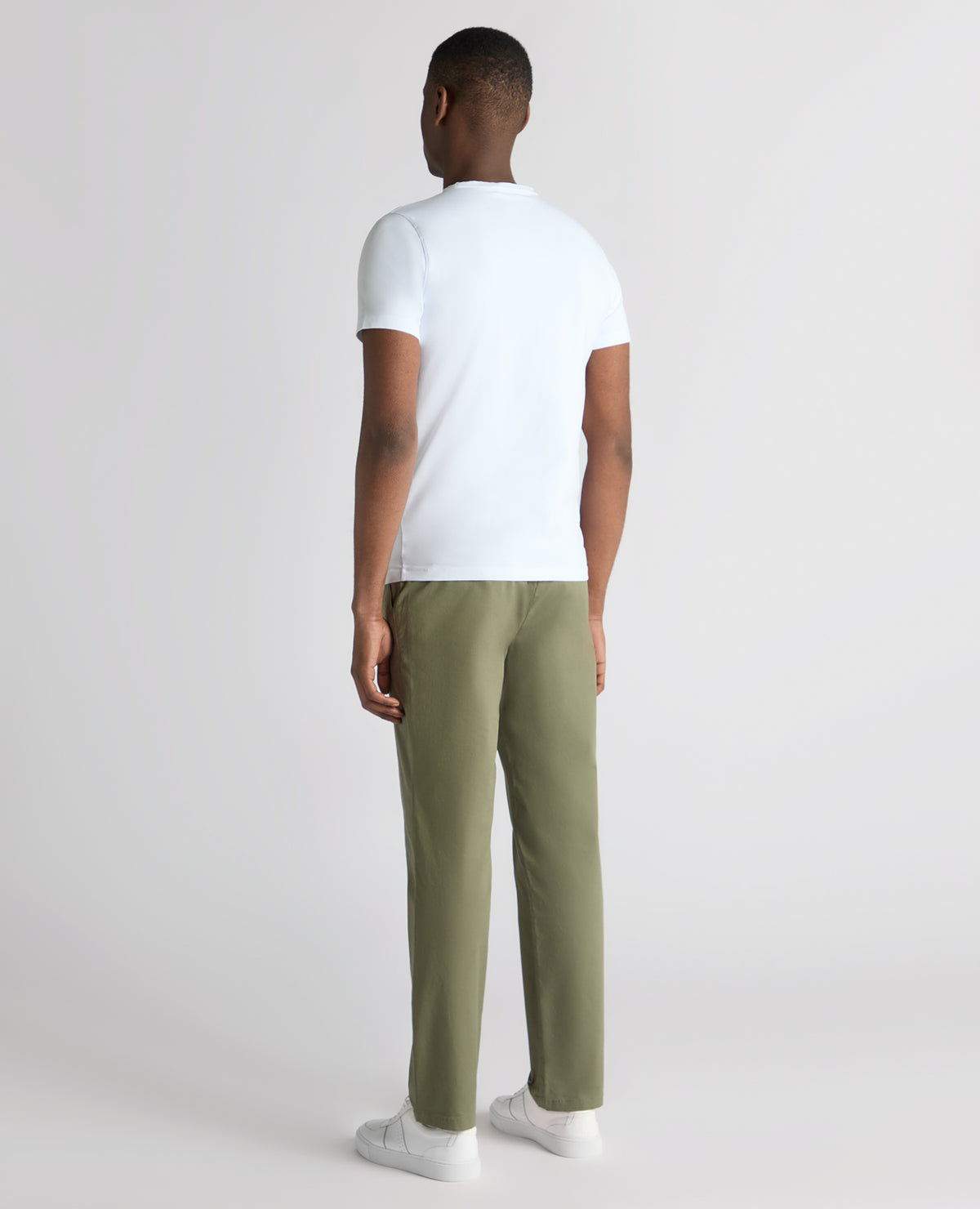 Man wearing a green Straight Leg Cotton Stretch Chino