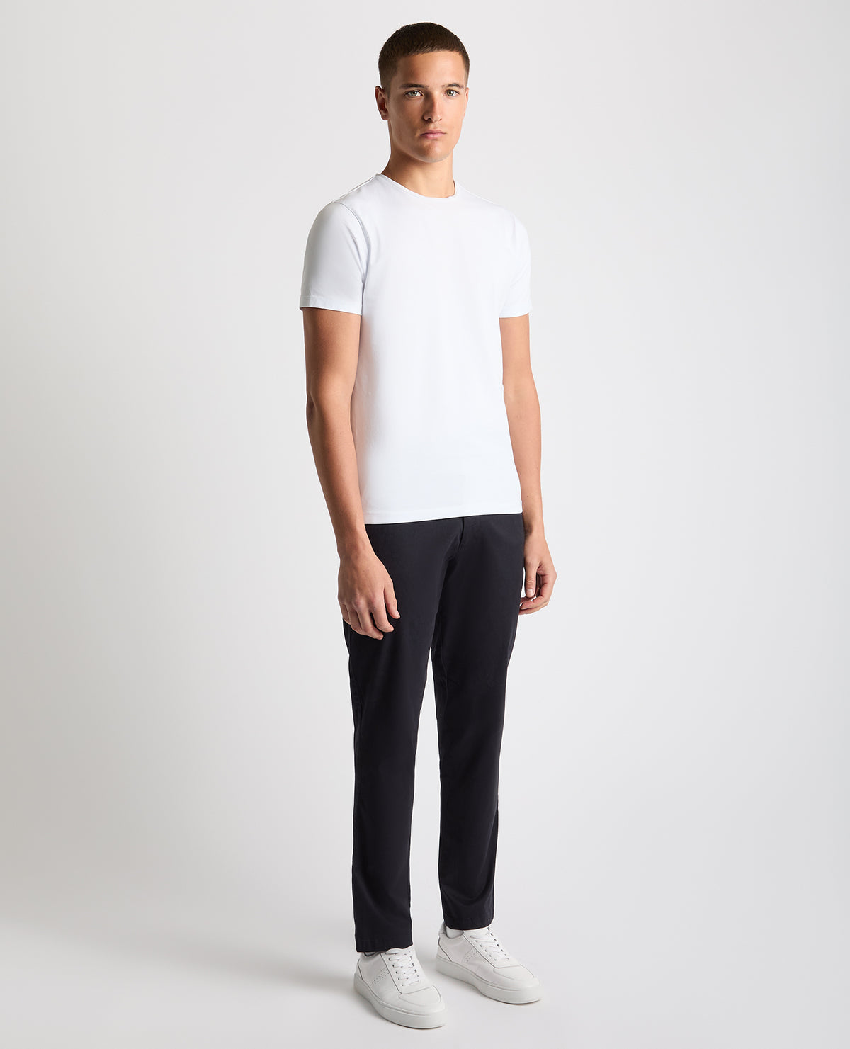 Man wearing a navy Straight Leg Cotton Stretch Chino
