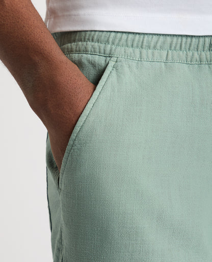 Man wearing a green Slim Fit Cotton-Linen Shorts