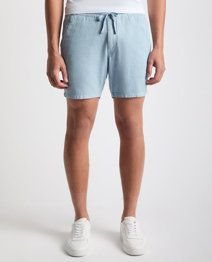 Man wearing a blue Slim Fit Cotton-Linen Shorts