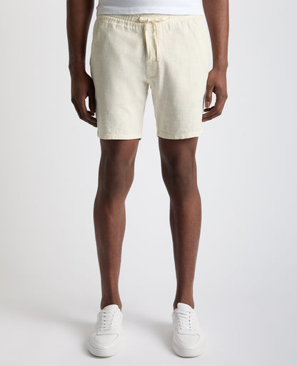 Man wearing a sand Slim Fit Cotton-Linen Shorts