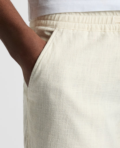 Man wearing a sand Slim Fit Cotton-Linen Shorts