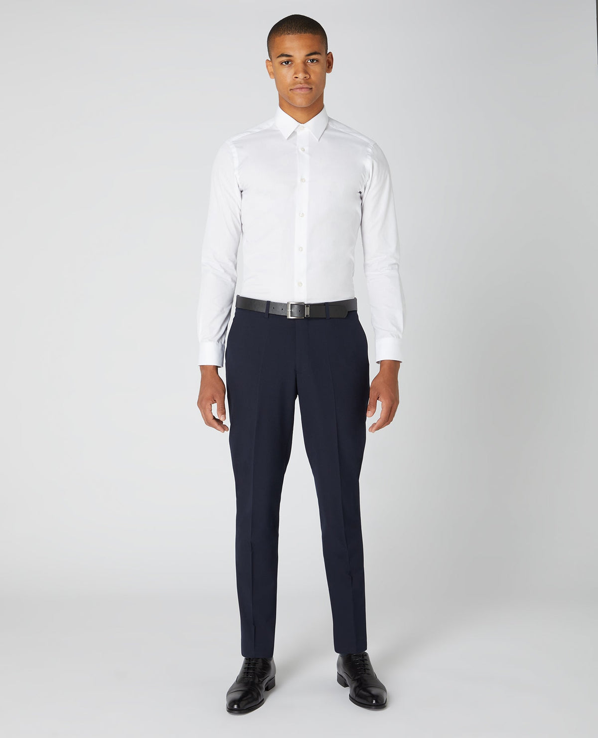 Man wearing a navy Slim Leg Formal Trousers