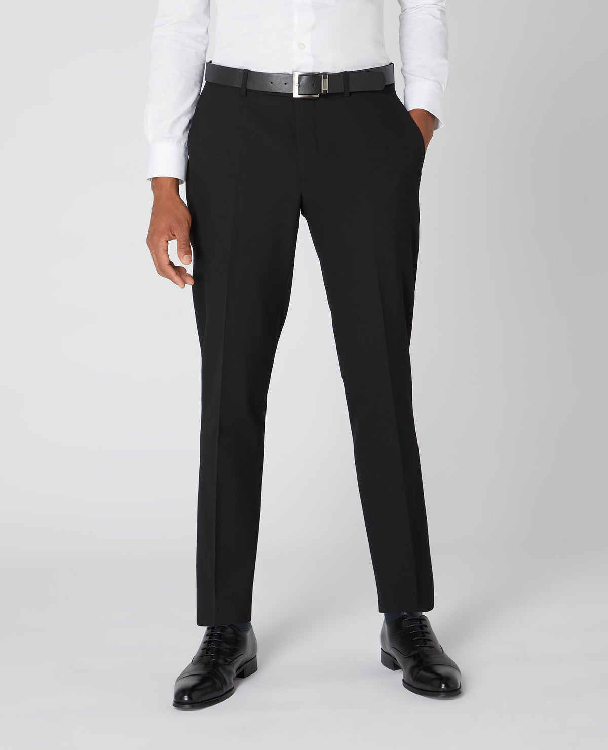 Man wearing a black Tapered Fit Formal Trousers